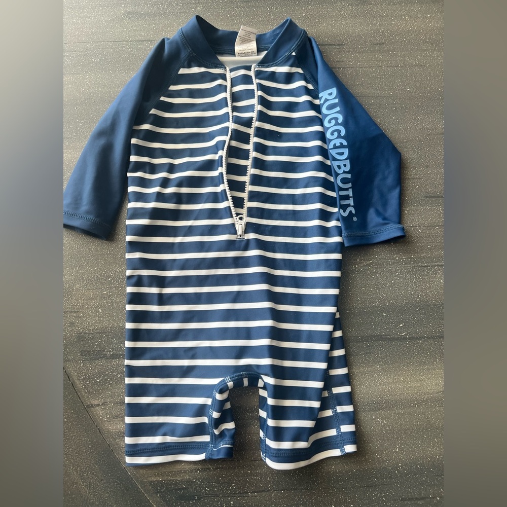 Ruggedbutts rashguard 6-12 months, navy & white stripes. Worn a handful of times